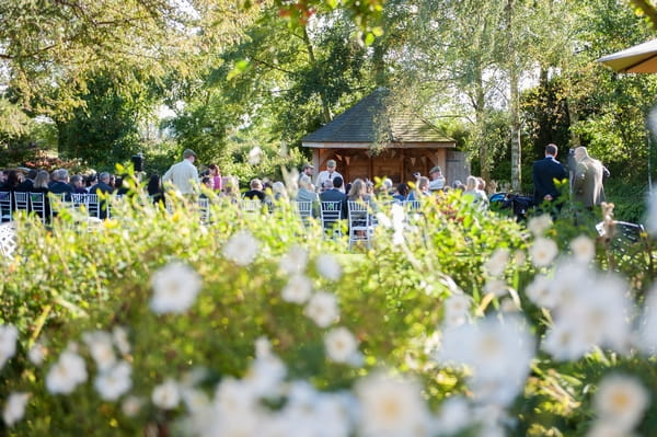 Wedding ceremony in Summer House in garden of South Farm