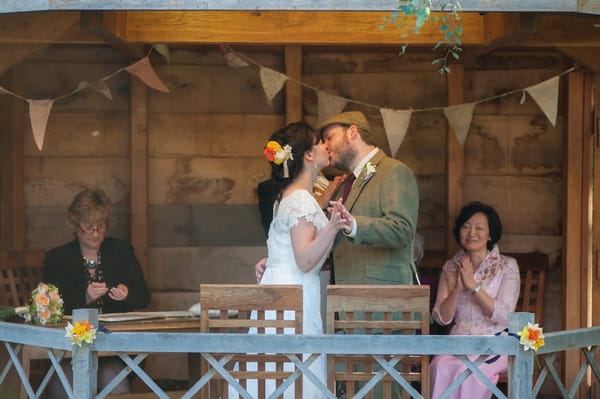 Bride and groom kiss