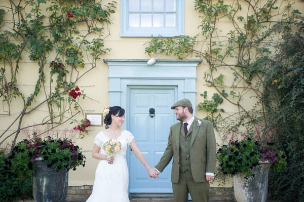 Bride and groom holding hands