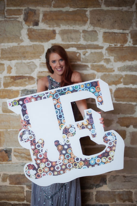 Bride holding letter E