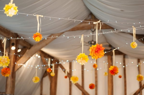 Paper flowers hanging from ceiling