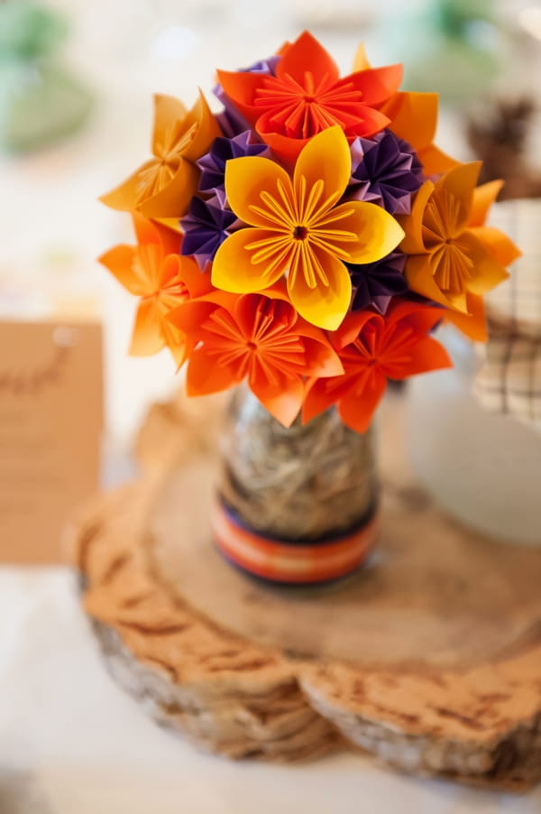 Orange paper wedding table flowers