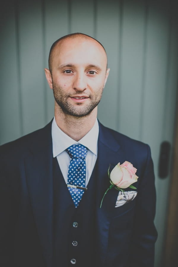 Groom wearing blue suit