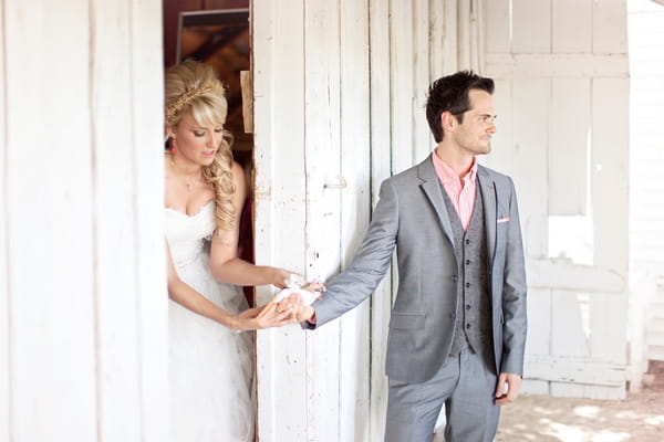 Groom handing bride a note