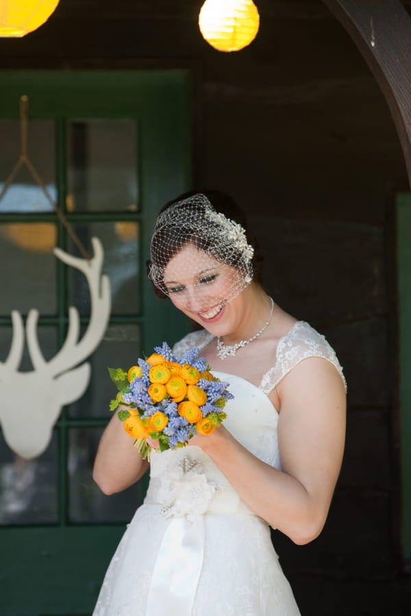 Bride holding yellow bouquet