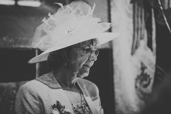 Lady with hat on at wedding