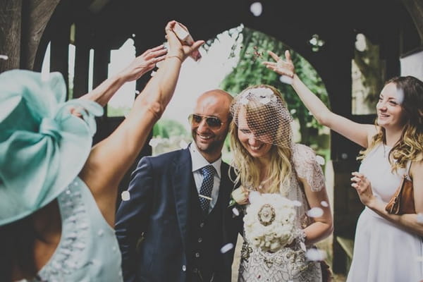 Bride and groom confetti shower