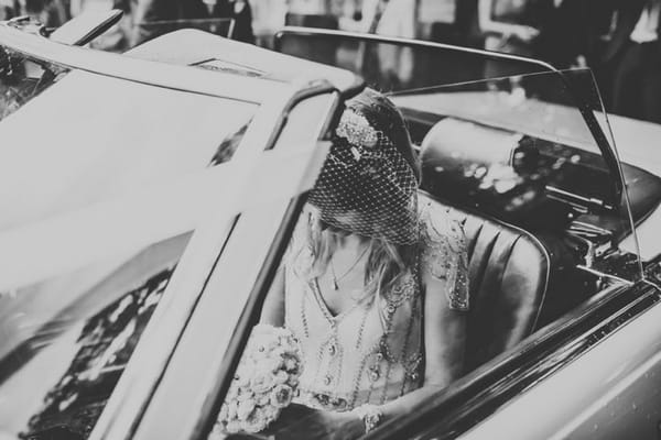 Bride in wedding car