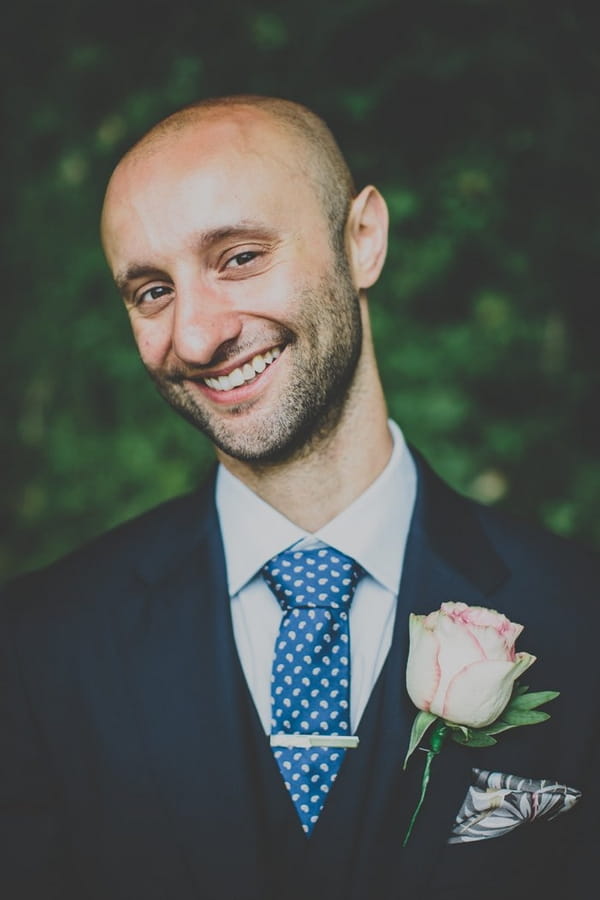 Groom smiling