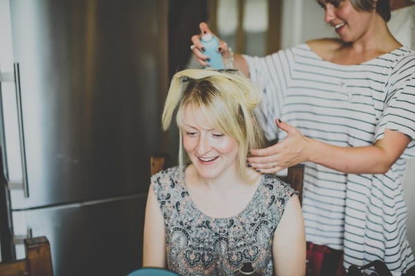 Bridesmaid having hair done