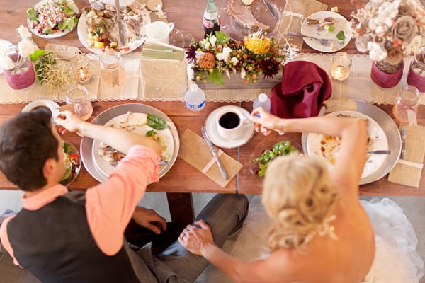 Bride and groom sat at table