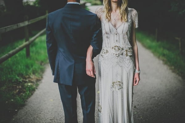 Bride and groom with arms linked