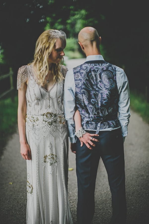 Bride with hand on groom's bottom