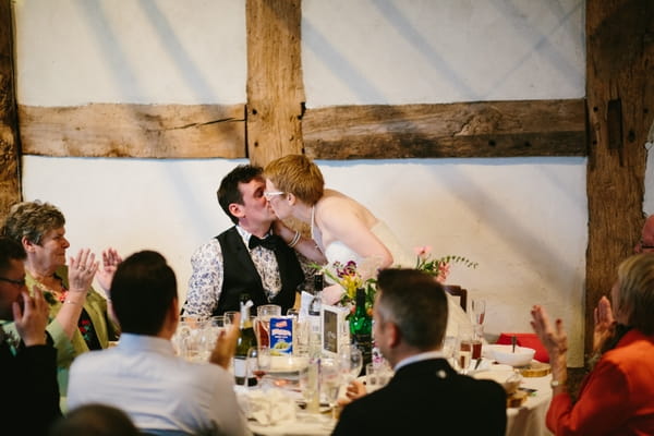 Bride kissing groom after speech