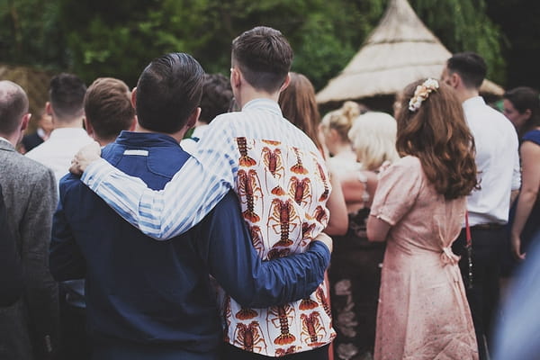 Guests watching wedding speech