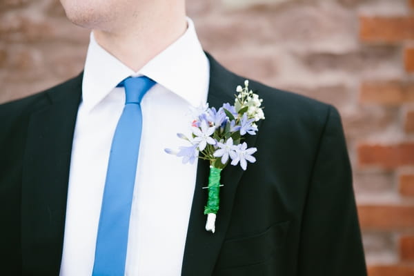 Blue skinny tie and buttonhole