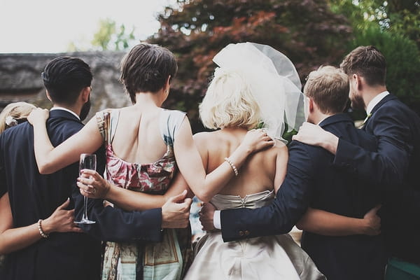 Bridal party hug