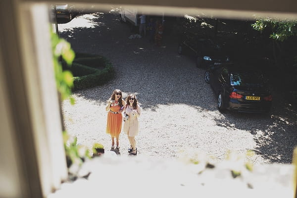 2 girls seen from window