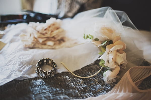 Floral headpiece on bed