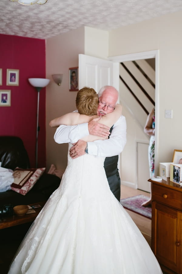 Bride hugging father