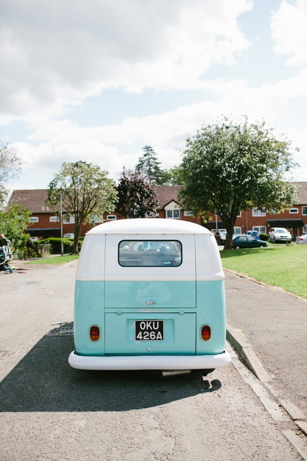 Back of turquoise VW Camper Van