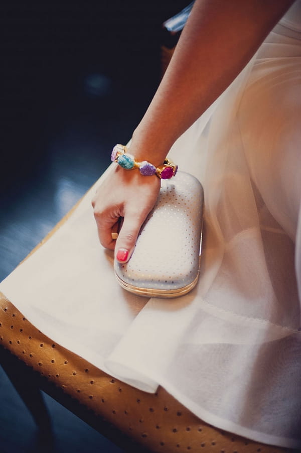Bride holding clutch bag