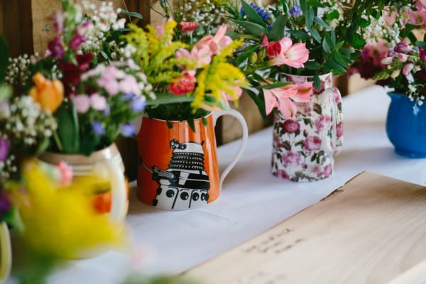 Jugs of wedding flowers