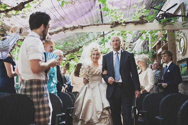 Father walking bride down aisle