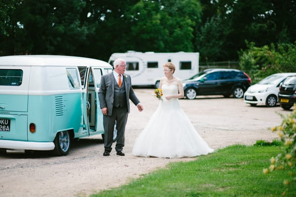 Bride arriving at wedding in VW Camper Van