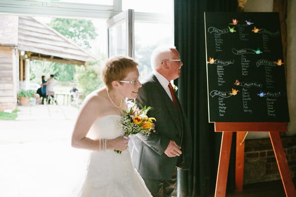 Father walking daughter down the aisle