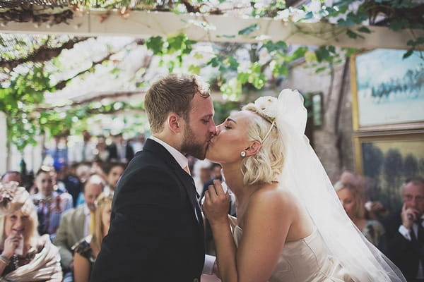 Bride kissing groom