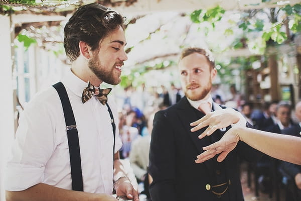 Bride and groom showing wedding rings