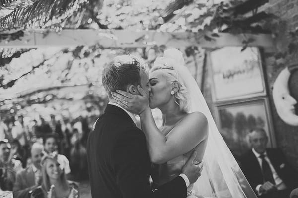 Bride and groom kiss