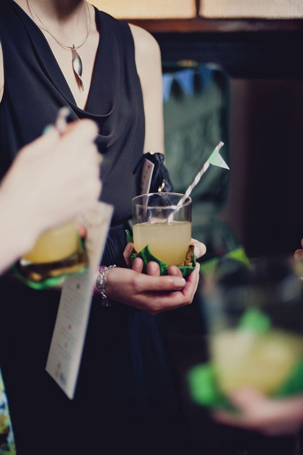 Wedding guest holding cocktail