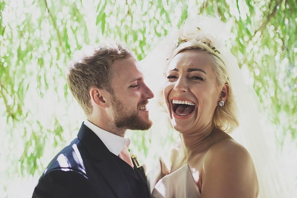 Bride and groom laughing