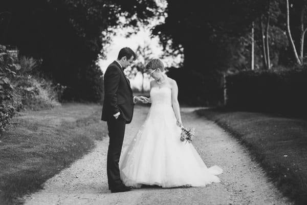 Bride looking at groom's wedding ring