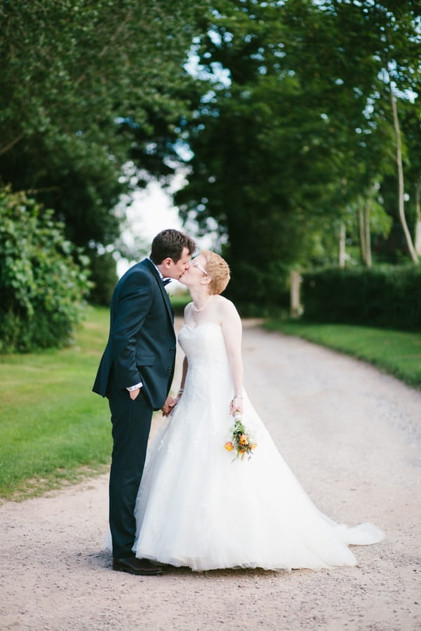 Bride and groom kiss