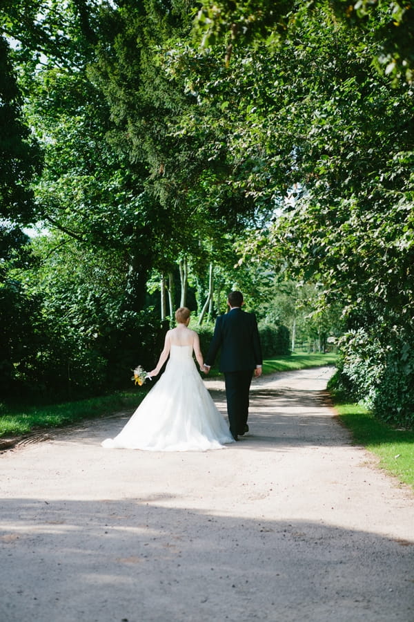 Bride and groom walking away