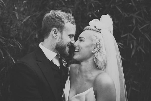 Bride and groom touching noses