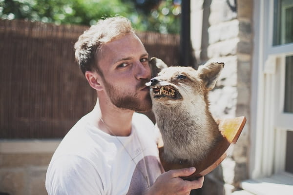 Man kissing taxidermy