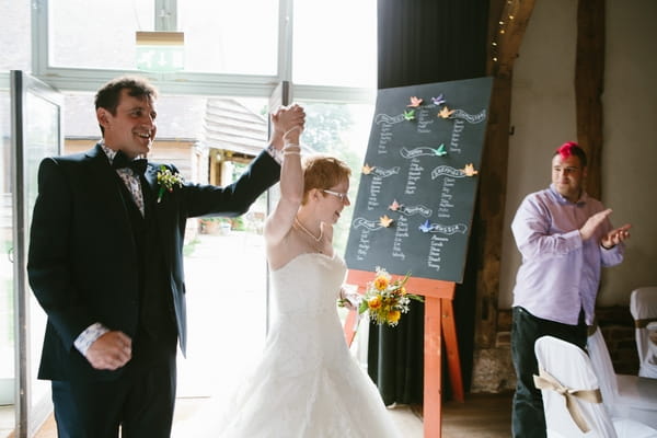 Bride and groom entering wedding breakfast