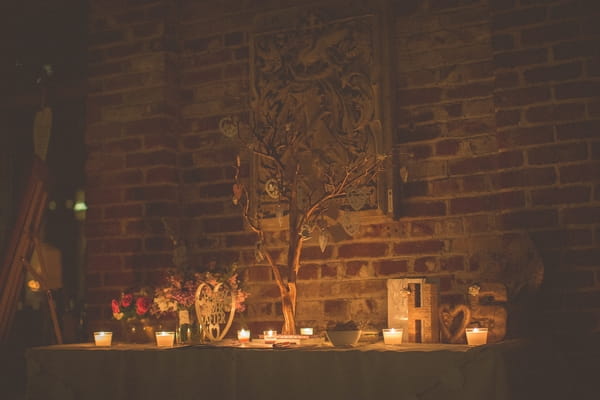 Wedding guest book table lit with candles