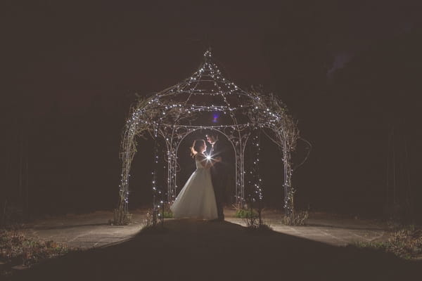 Bride and groom at Gaynes Park at night