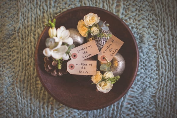 Bowl of wedding buttonholes