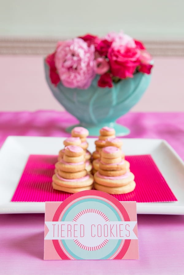 Tiered cookies on square plate with label