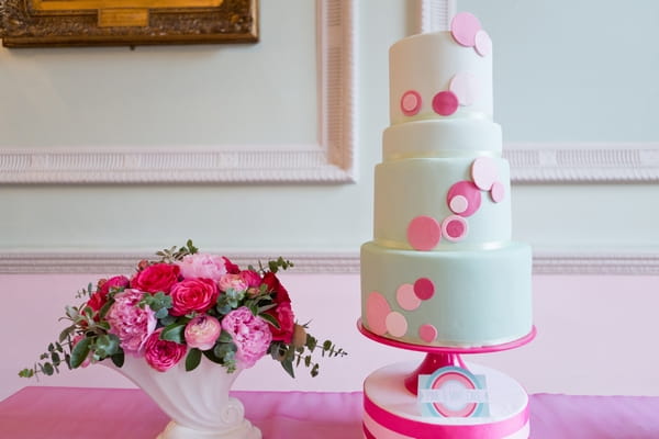 Mint coloured wedding cake with spots, and flowers