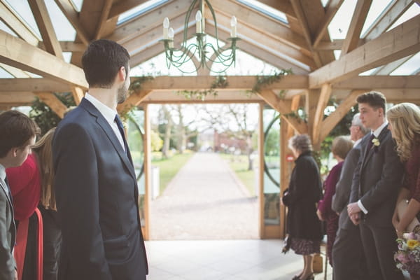 Groom waiting at altar for bride