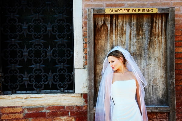 Bride in front of door