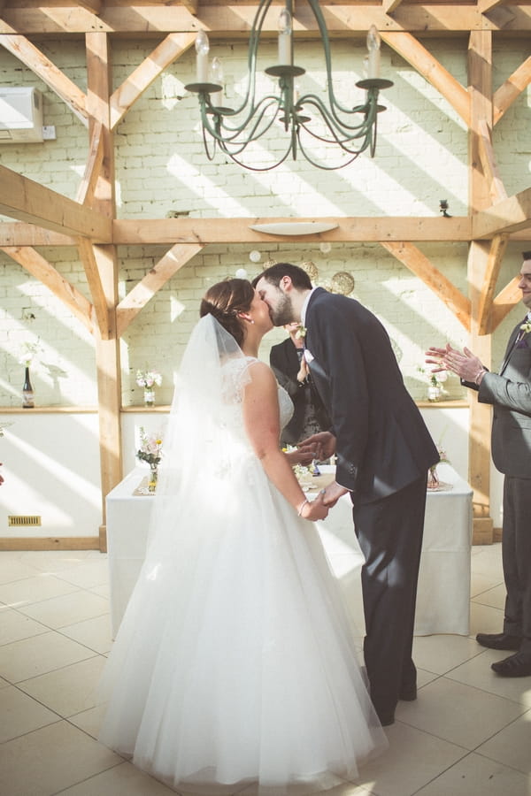 Bride and groom kiss