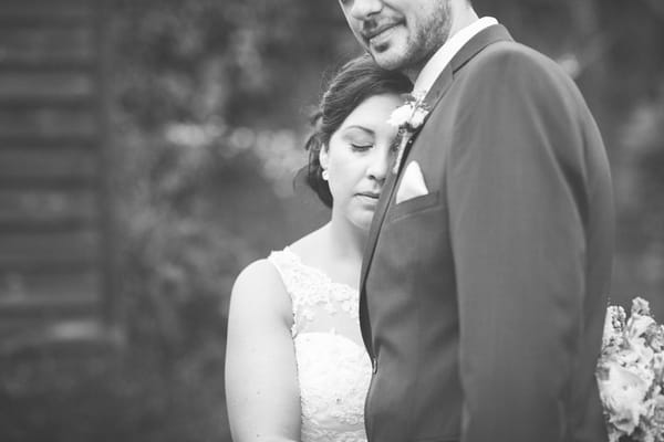 Bride resting head on groom